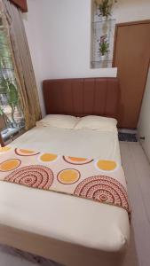 Postel nebo postele na pokoji v ubytování GIO Guesthouse Bogor