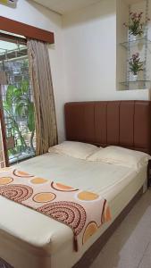 Postel nebo postele na pokoji v ubytování GIO Guesthouse Bogor