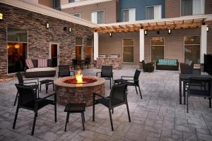 a patio with a table and chairs and a fire pit at Residence Inn by Marriott Lynchburg in Lynchburg
