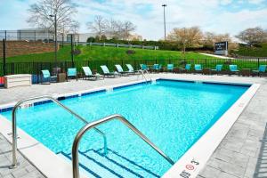 a large swimming pool with chairs at Residence Inn by Marriott Lynchburg in Lynchburg