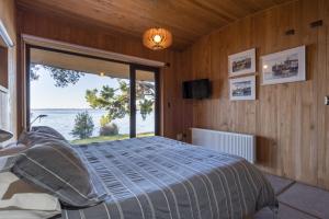 Postel nebo postele na pokoji v ubytování Casas Martín Pescador, Lago Huillinco, Chiloe