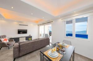 a living room with a couch and a table at Aren Guest House in Kalkan in Kaş