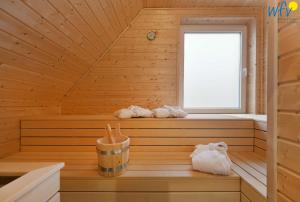 a sauna with two towels in a wooden cabin at Haus Mittelstraße Ferienwohnung Zauberland in Juist +46 photos