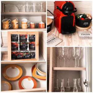 a cupboard with plates and glasses and a cupboard with dishes at Home Away From Home - New Cosy Apartment Kruge in Zagreb