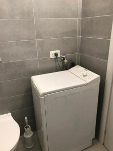 a small bathroom with a toilet and a sink at Casamina in Bellinzago Lombardo +5 photos