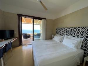Postel nebo postele na pokoji v ubytování Le Capase Resort Salento