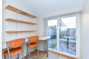 a kitchen with a table and two chairs and a window at Morgan House- 4 Bed House, Near Nottingham Trent Uni in Nottingham