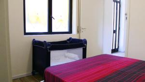Postel nebo postele na pokoji v ubytování Lago Maggiore Lake Me Home apartment