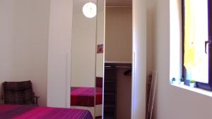 Postel nebo postele na pokoji v ubytování Lago Maggiore Lake Me Home apartment