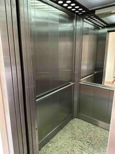 a stainless steel refrigerator in a room at Departamento en Merlo Centro in Merlo