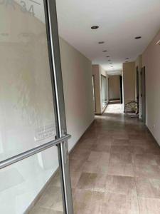 an empty hallway of a building with a hallway Gh Ubestosbestosbestosbestosbestos at Departamento en Merlo Centro in Merlo