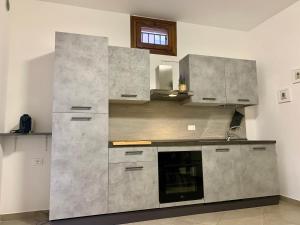 A kitchen or kitchenette at CENTRAL HOME CHIOGGIA [in the historic center]