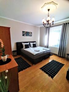 Postel nebo postele na pokoji v ubytování Elza Apartman