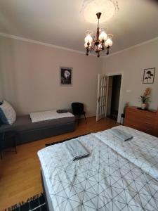 Postel nebo postele na pokoji v ubytování Elza Apartman