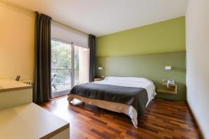 Voodi või voodid majutusasutuse Hotel Robert toas