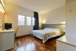 Voodi või voodid majutusasutuse Hotel Robert toas