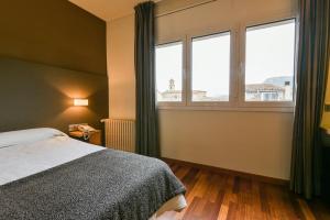 Voodi või voodid majutusasutuse Hotel Robert toas