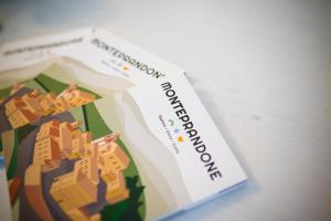 a book with a picture of a city at Brigida B&B in Monteprandone