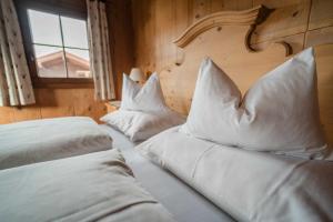 Łóżko lub łóżka w pokoju w obiekcie Gästehaus Leirerhäusl