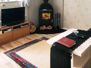 A television and/or entertainment centre at Holiday home GOTLANDS TOFTA VI