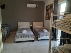 Posteľ alebo postele v izbe v ubytovaní Galotel Agnoudas near the airport