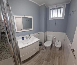 a bathroom with a sink and a toilet at Eldorado VIVIAN-STUDIO FREE WIFI in Playa de las Americas +5 photos