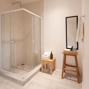 a shower with a glass enclosure in a bathroom at Spookdraai B&B in Agulhas