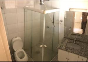 a bathroom with a shower and a toilet and a sink at Kasa Kaya in Araraquara +35 photos