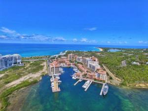 an aerial view of a resort in the water at 2-Bed Designer Apartment Sleeps 6 with Pool in Cupecoy +7 photos