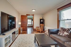 a living room with a couch and a tv at Spacious Home in Ramsay 9 Smart TVs and Pool Table! in Ramsay