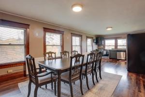 a dining room with a table and chairs at Spacious Home in Ramsay 9 Smart TVs and Pool Table! in Ramsay