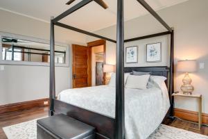 a bedroom with a four poster canopy bed at Spacious Home in Ramsay 9 Smart TVs and Pool Table! in Ramsay