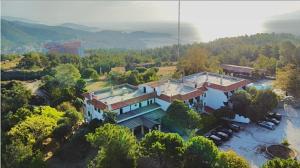 an aerial view of a large house in the water at Philoxenia in Kavála
