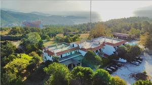 an aerial view of a large house in the water at Philoxenia in Kavala