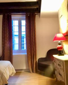 Letto o letti in una camera di L’AMANTINE Chambres d’hôtes et gîte