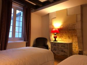 Letto o letti in una camera di L’AMANTINE Chambres d’hôtes et gîte