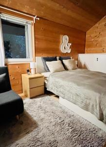 Giường trong phòng chung tại Chalet - Kleines Paradies -