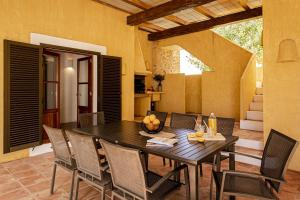 a dining room with a table and chairs at CAN NOVES - Villa de 5 suites 31 y 9 in Sant Francesc Xavier