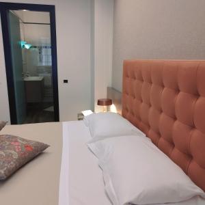 Postel nebo postele na pokoji v ubytování Casaalbergo La Rocca