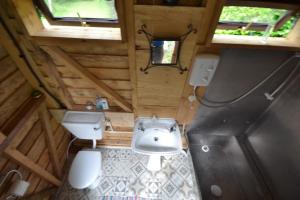 an overhead view of a bathroom with a sink and toilet at Snowdonia Hideaway in Tywyn