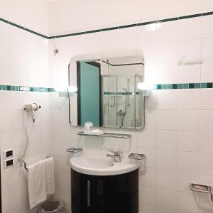 Koupelna v ubytování Casaalbergo La Rocca