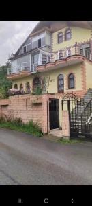 a large brick house with a gate in front of it at Beyaz hostel in Trabzon