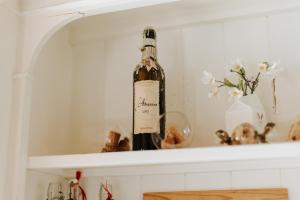 a bottle of wine sitting on a shelf at Dimora Buglioni Wine Relais in San Pietro in Cariano