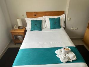 Letto o letti in una camera di Hotel Reycer