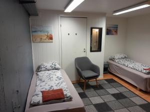 Postel nebo postele na pokoji v ubytování Wilhelmsen Romutleie