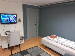 Postel nebo postele na pokoji v ubytování Wilhelmsen Romutleie