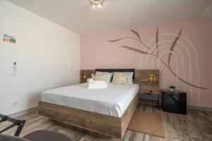 Postel nebo postele na pokoji v ubytování Leevin Guesthouse