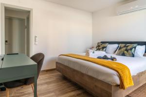 Postel nebo postele na pokoji v ubytování Leevin Guesthouse