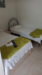 Voodi või voodid majutusasutuse Hotel El Negro toas
