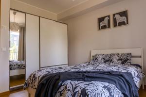 Postel nebo postele na pokoji v ubytování Vibu Apartment